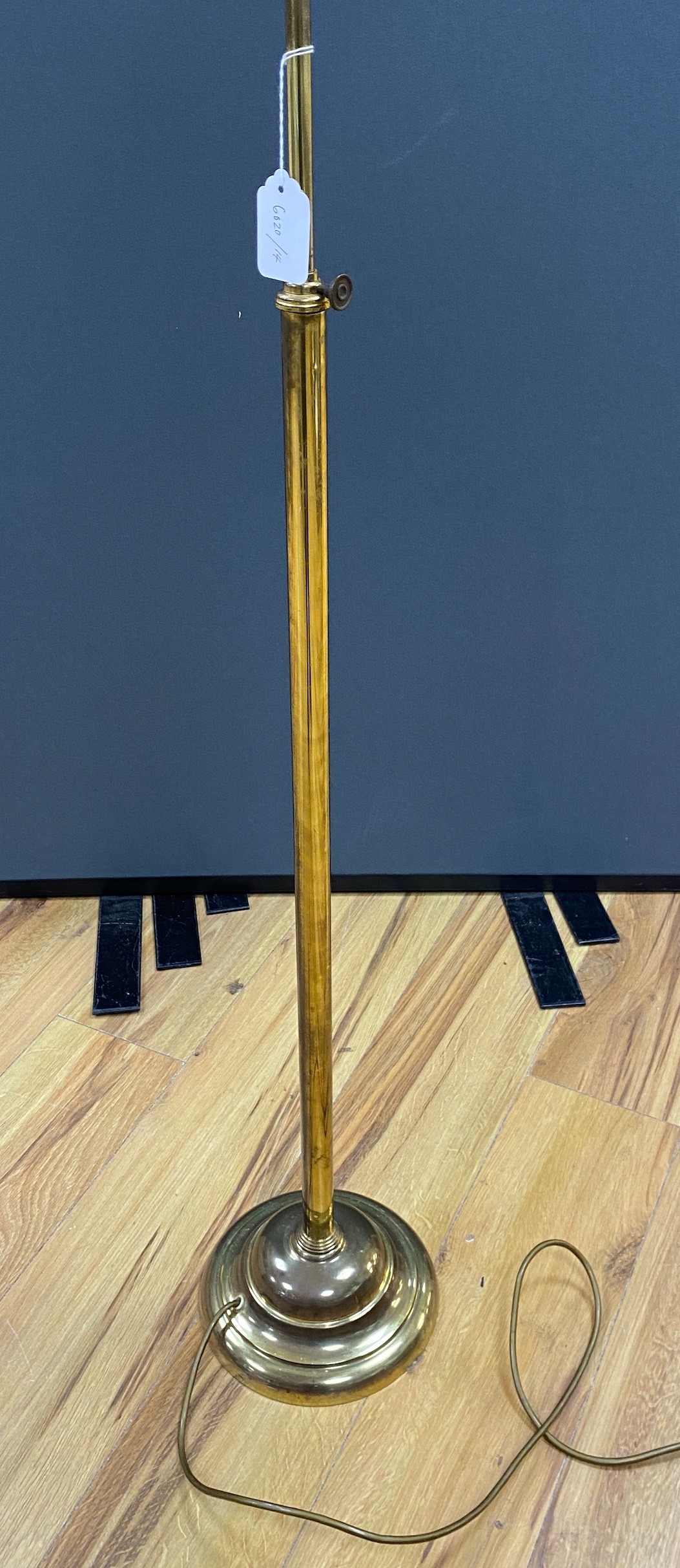 An early 20th century brass adjusting telescopic floor lamp